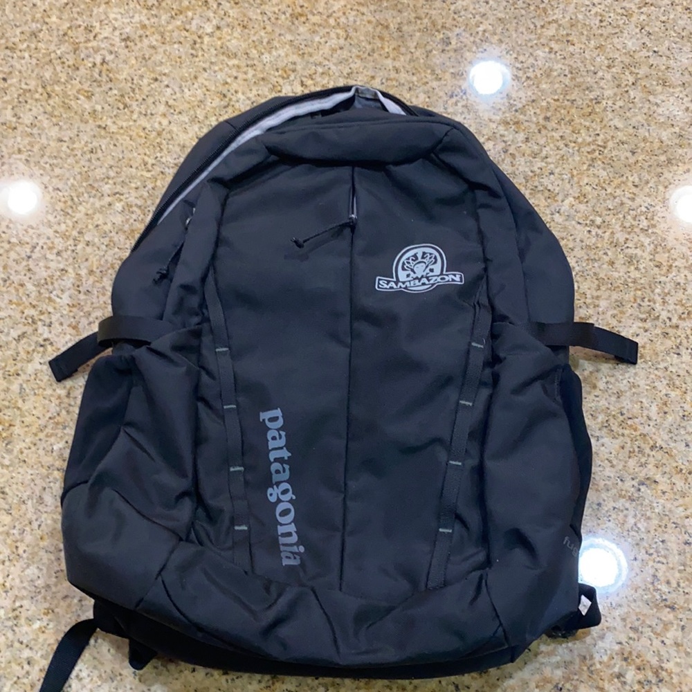 Patagonia black backpack. With padding and pockets
